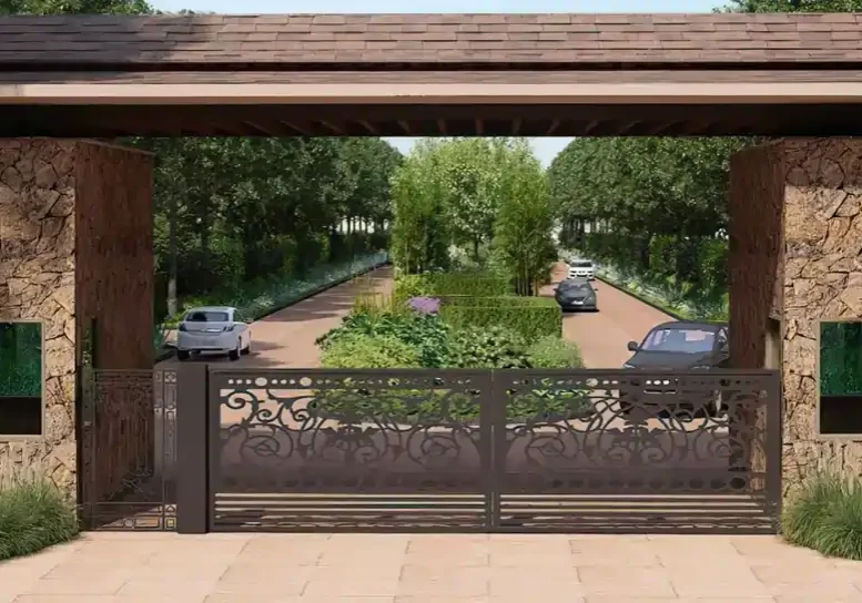 Aranyaka Farms with green fields, trees, and farm structures near a forested area, reflecting sustainable rural living.